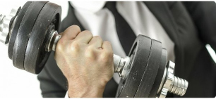 a man holding a dumbbell